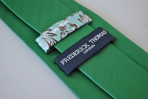 plain green tie with herringbone pattern